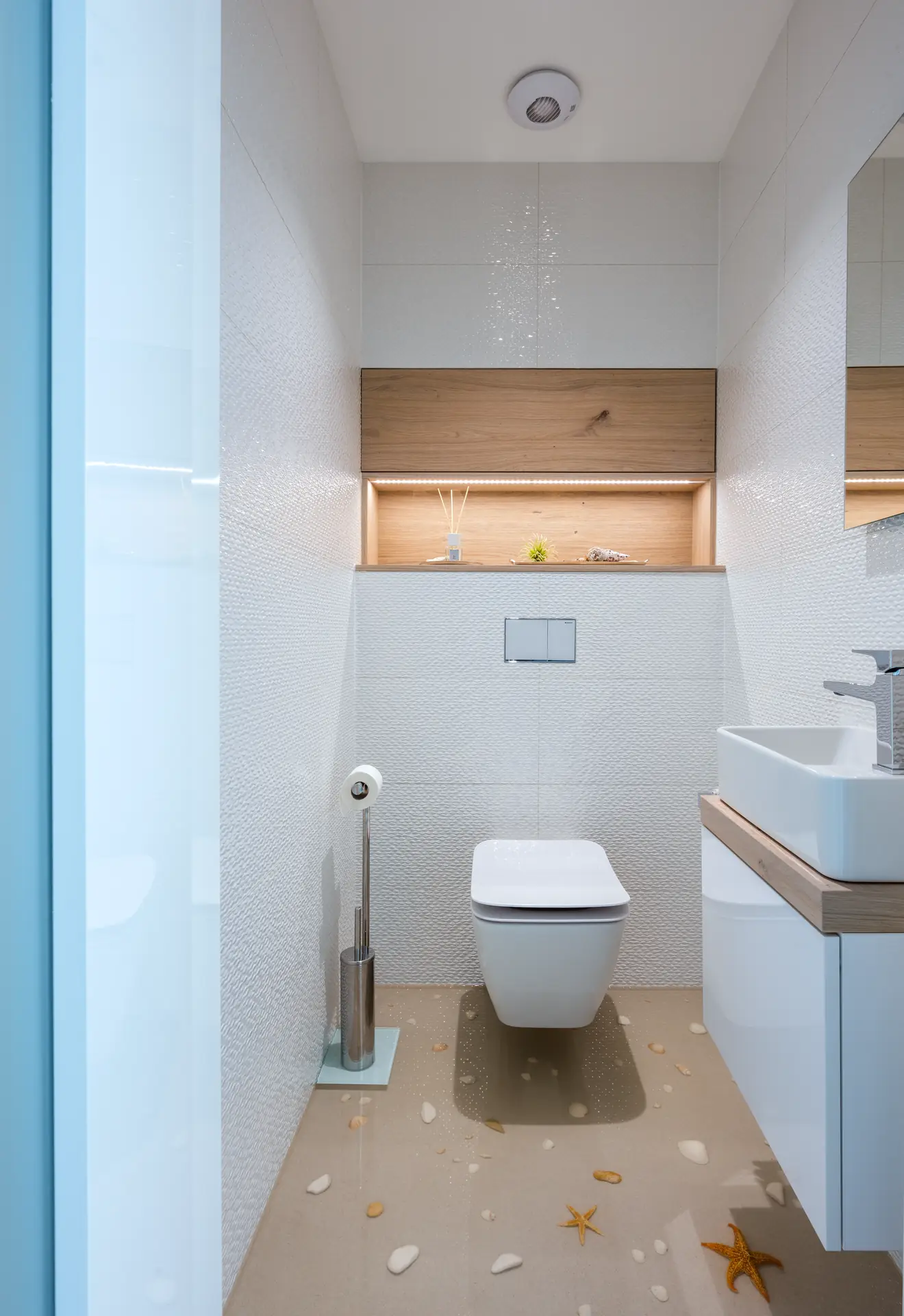 Bathroom with textured tiling and a counter-top basin