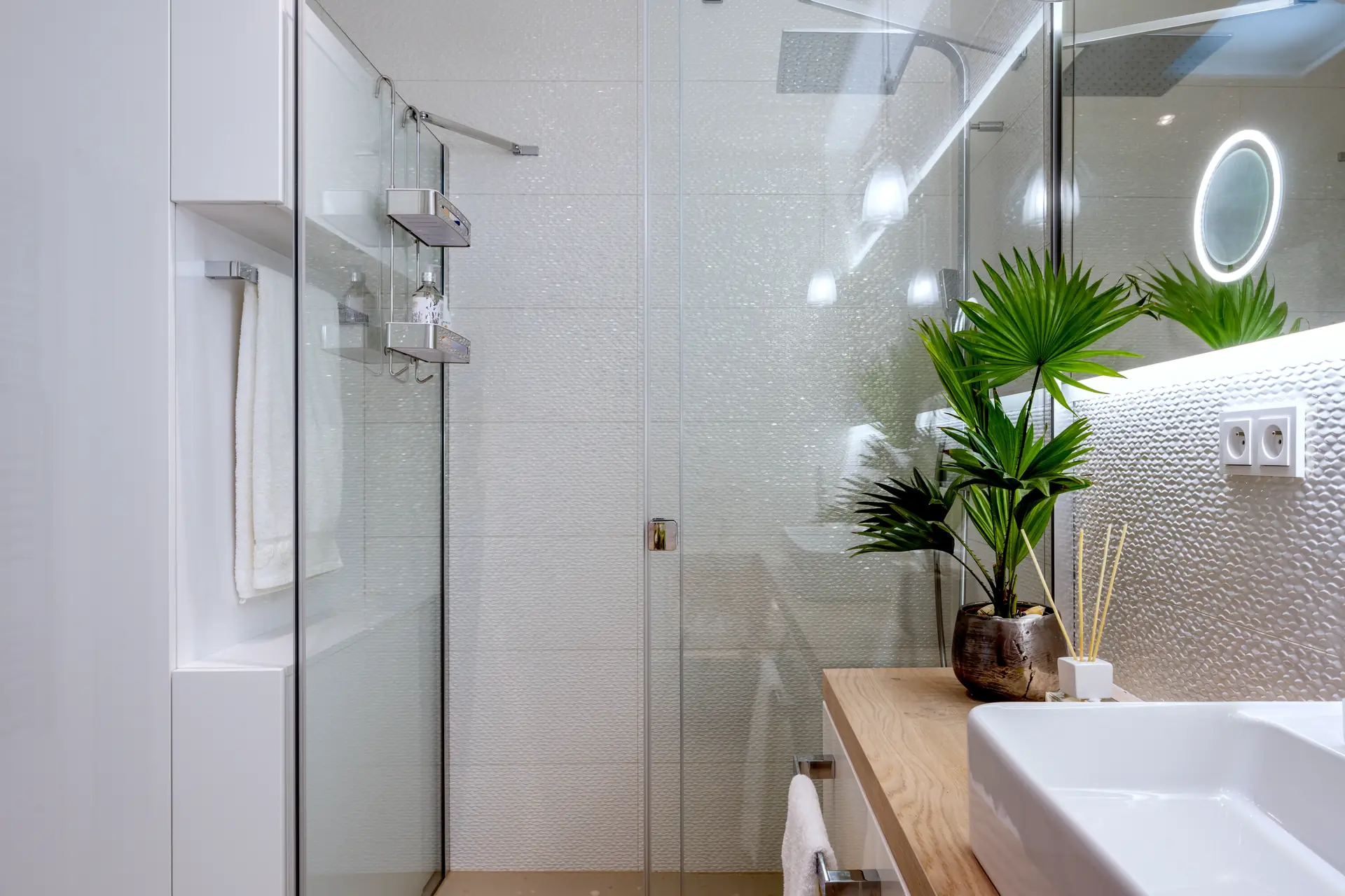 Glazed walk-in shower with black fixtures