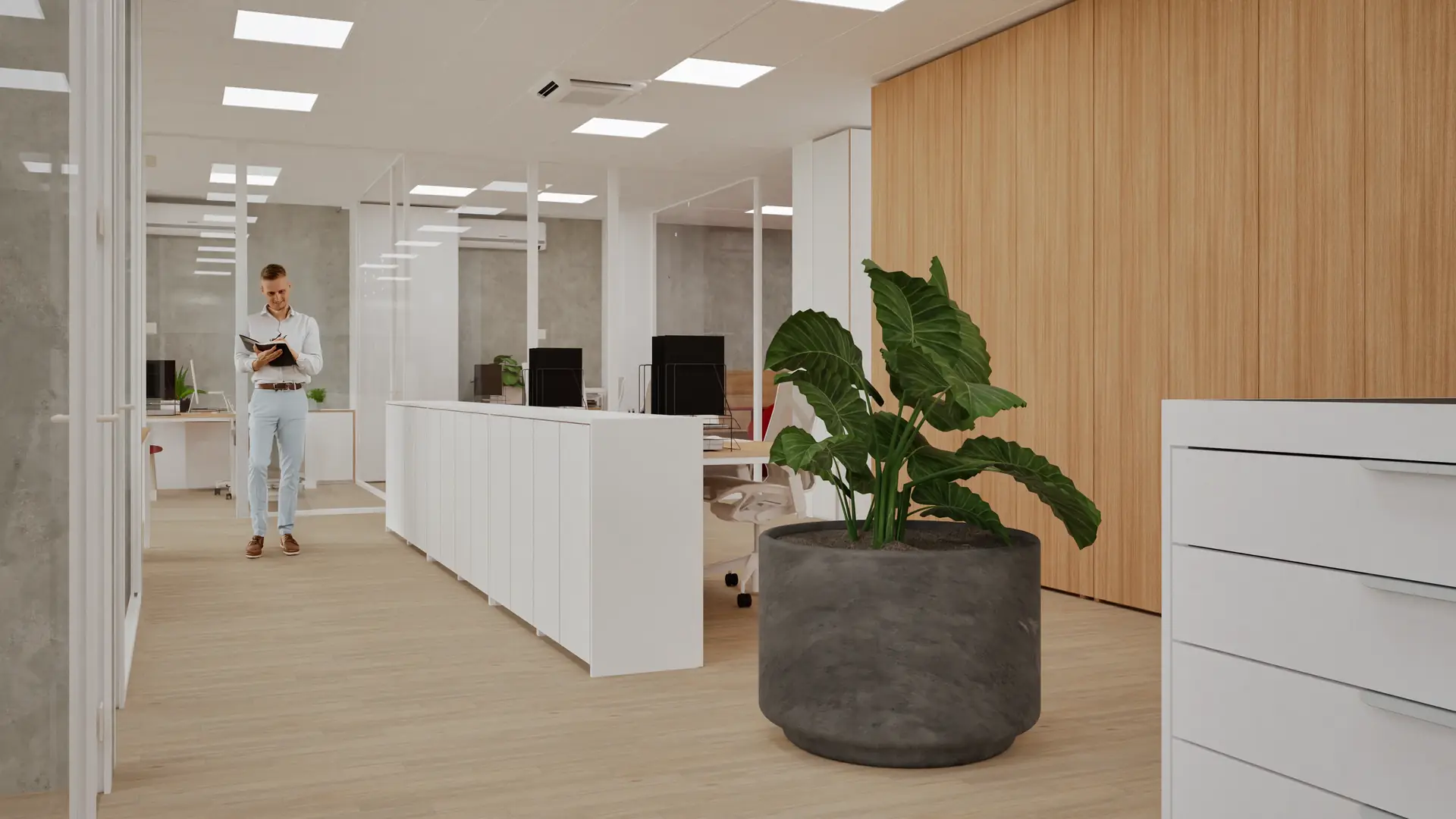 Open-plan area with workstations and greenery
